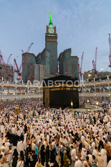 Getting closer to God and performing the rituals of Hajj and Umrah, pilgrims of the Holy House of God circumambulating the courtyards of the Holy Mosque in Mecca, sacred Islamic religious places and landmarks, the clock tower in Mecca, the Kingdom of Saudi Arabia