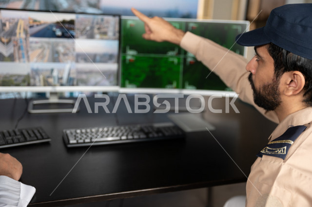 A close-up picture of a Saudi Arabian Gulf man working as a security man, wearing uniforms to work, maintaining security and reassurance, guarding and safety