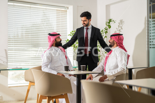 Discussions and dialogues about projects, developing plans and achieving the company’s goals, cooperation and participation in completing work, Saudi Gulf Arab businessmen who manage and organize work affairs, office administrative professions and jobs.