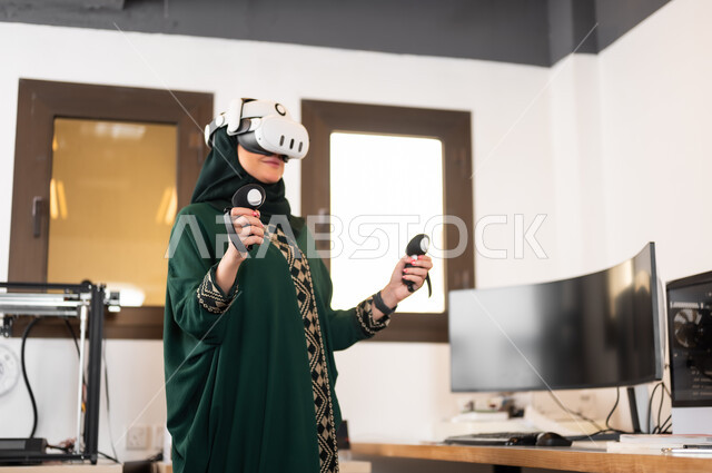 Simulating the imaginary world, using advanced modern devices and techniques, a veiled Saudi Arabian Gulf woman wearing 3D glasses standing inside her office and holding control devices in her hand, digital transformation and technical progress, expressions and gestures of integration and focus in virtual reality