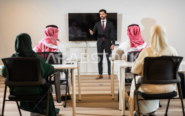 Discussing plans and explaining business tasks, cooperation and understanding between the team, training employees on work policies and tasks to achieve goals in the meeting room inside the company’s headquarters, a comfortable work environment in Saudi companies, conducting recruitment and hiring interviews.