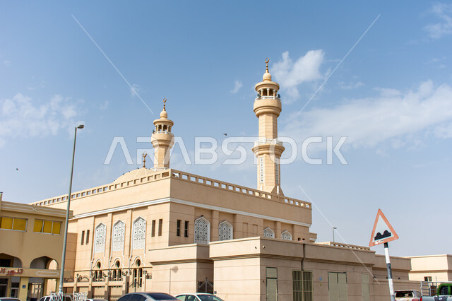 The minarets of the mosque in the Arab style, establishing prayer and performing religious duties, Islamic architectural art in the United Arab Emirates, raising the voice of the call to prayer and calling Muslims to prayer, a mosque in the city of Al Ain in the Emirate of Abu Dhabi, worship and getting closer to God