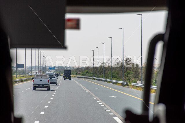 Securing roads and public transportation, improving infrastructure and paved asphalt streets that are suitable for travel and transportation in the United Arab Emirates, the highway leading to the city of Al Ain from the Emirate of Dubai.