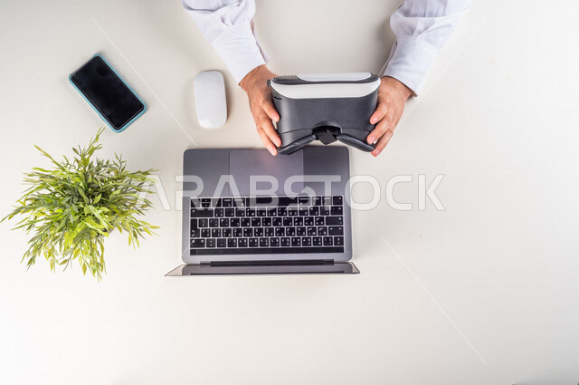 A 3D movie maker, a Gulf expert in the field of virtual world, special VR-box glasses for seeing 3D models, a working environment, a white background.