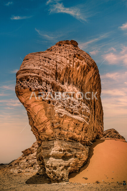 Rock formations and formations in the desert of Al-Ula Governorate, mountain peaks and heights in the sandy environment, natural landscapes in the desert regions of the Kingdom of Saudi Arabia, ancient historical monuments, famous tourist places.