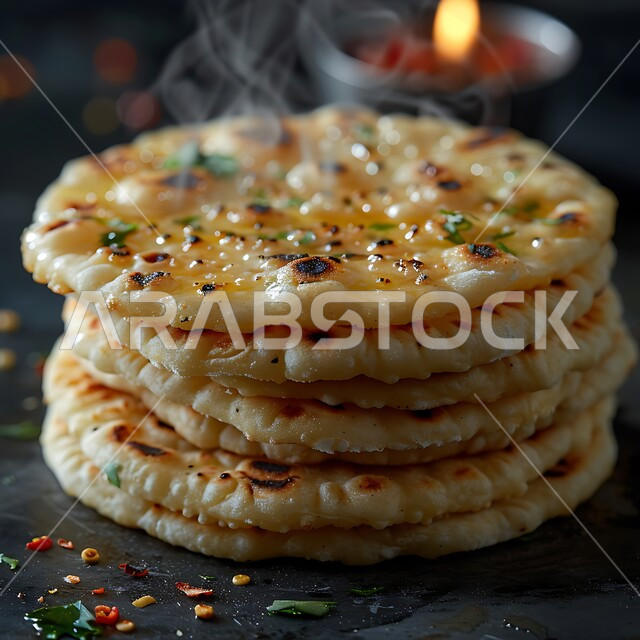 Bread spread in the popular oven, bakeries and ovens in the Kingdom of Saudi Arabia, fresh hot baked goods, local Saudi national products, loaves of traditional Arabic bread (pita)