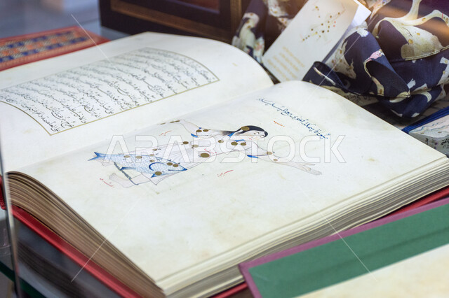 An old heritage book displayed at the 2024 Abu Dhabi International Book Fair, old copies of antique books, exhibitions and events in the United Arab Emirates, the world of books and publishing, famous tourist attractions and places in the Emirate of Abu Dhabi, cultural and entertainment departments and pavilions.