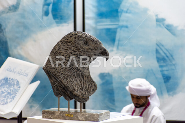Artworks symbolizing strength and challenge, a sculpture of a falcon’s head displayed at the Abu Dhabi International Book Fair 2024, exhibitions and events in the United Arab Emirates, the world of books and publishing, famous landmarks and tourist places in the Emirate of Abu Dhabi.