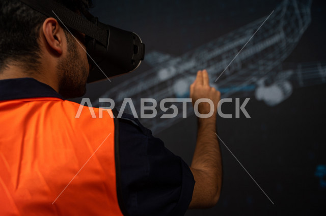 خاصية الهولوجرام ، مهندس سعودي ماهر محترف في صناعة الطائرات، رجل مهندس خليجي ، استخدام تقنية الهولوجرام ثلاثية الابعاد ، صور تجسيمية خاصة بمجسمات الطائرات و هياكلها ، صور متحركة بأبعاد مختلفة ، تصوير ثلاثي الابعاد للأجسام