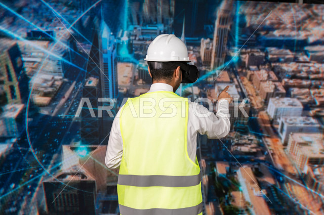 خاصية الهولوجرام  ، مهندس سعودي ماهر محترف في التخطيط ، رجل مهندس خليجي ، استخدام تقنية الهولوجرام ثلاثية الابعاد ، صور تجسيمية خاصة بالمنشأت و الابراج المعمارية ، صور هندسية بأبعاد مختلفة ، تصوير ثلاثي الابعاد للأجسام 