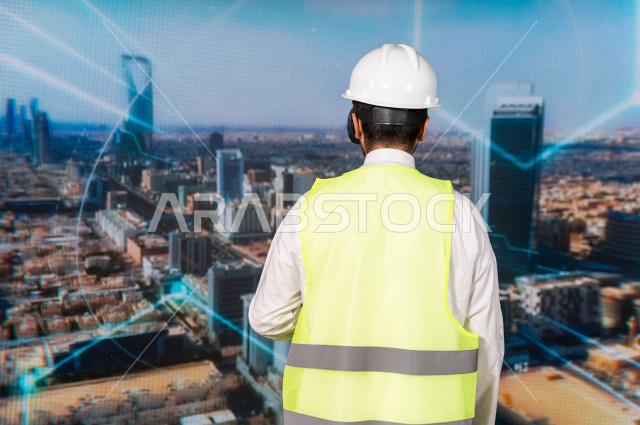 خاصية الهولوجرام  ، مهندس سعودي ماهر محترف في التخطيط ، رجل مهندس خليجي ، استخدام تقنية الهولوجرام ثلاثية الابعاد ، صور تجسيمية خاصة بالمنشأت و الابراج المعمارية ، صور هندسية بأبعاد مختلفة ، تصوير ثلاثي الابعاد للأجسام 