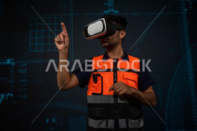 خاصية الهولوجرام  ، مهندس سعودي ماهر محترف في التخطيط ، رجل مهندس خليجي ، استخدام تقنية الهولوجرام ثلاثية الابعاد ، صور تجسيمية خاصة بالمنشأت و الابراج المعمارية ، صور هندسية بأبعاد مختلفة ، تصوير ثلاثي الابعاد للأجسام 