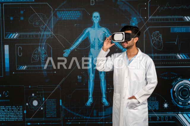 Hologram feature, a Saudi Gulf doctor with high experience in the field of human medicine, puts a VR Box device, using 3D hologram technology, stereoscopic images of human structures and organs, moving images in different dimensions, 3D imaging of bodies