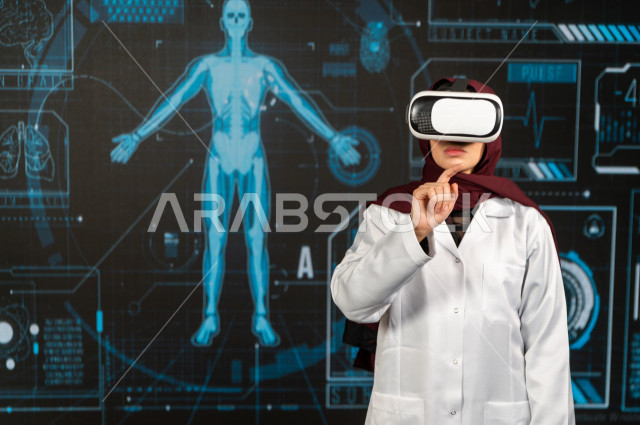 خاصية الهولوجرام ، طبيبة سعودية خليجية ذو خبرة عالية في مجال الطب البشري  ،تضع جهازVR Box،  استخدام تقنية الهولوجرام ثلاثية الابعاد ، صور تجسيمية خاصة بمجسمات الهياكل البشرية  و الاعضاء ، صور متحركة بأبعاد مختلفة ، تصوير ثلاثي الابعاد للأجسام