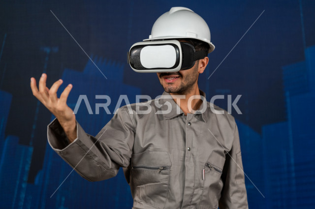 خاصية الهولوجرام  ، مهندس سعودي ماهر محترف في التخطيط ، رجل مهندس خليجي ، استخدام تقنية الهولوجرام ثلاثية الابعاد ، صور تجسيمية خاصة بالمنشأت و الابراج المعمارية ، صور هندسية بأبعاد مختلفة ، تصوير ثلاثي الابعاد للأجسام 