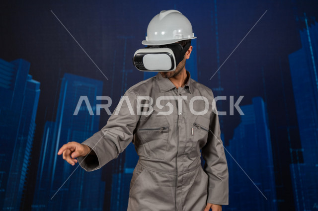 خاصية الهولوجرام  ، مهندس سعودي ماهر محترف في التخطيط ، رجل مهندس خليجي ، استخدام تقنية الهولوجرام ثلاثية الابعاد ، صور تجسيمية خاصة بالمنشأت و الابراج المعمارية ، صور هندسية بأبعاد مختلفة ، تصوير ثلاثي الابعاد للأجسام 