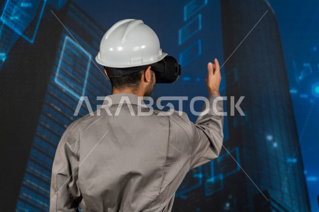 خاصية الهولوجرام  ، مهندس سعودي ماهر محترف في التخطيط ، رجل مهندس خليجي ، استخدام تقنية الهولوجرام ثلاثية الابعاد ، صور تجسيمية خاصة بالمنشأت و الابراج المعمارية ، صور هندسية بأبعاد مختلفة ، تصوير ثلاثي الابعاد للأجسام 