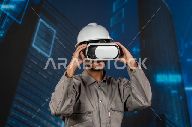 خاصية الهولوجرام  ، مهندس سعودي ماهر محترف في التخطيط ، رجل مهندس خليجي ، استخدام تقنية الهولوجرام ثلاثية الابعاد ، صور تجسيمية خاصة بالمنشأت و الابراج المعمارية ، صور هندسية بأبعاد مختلفة ، تصوير ثلاثي الابعاد للأجسام 