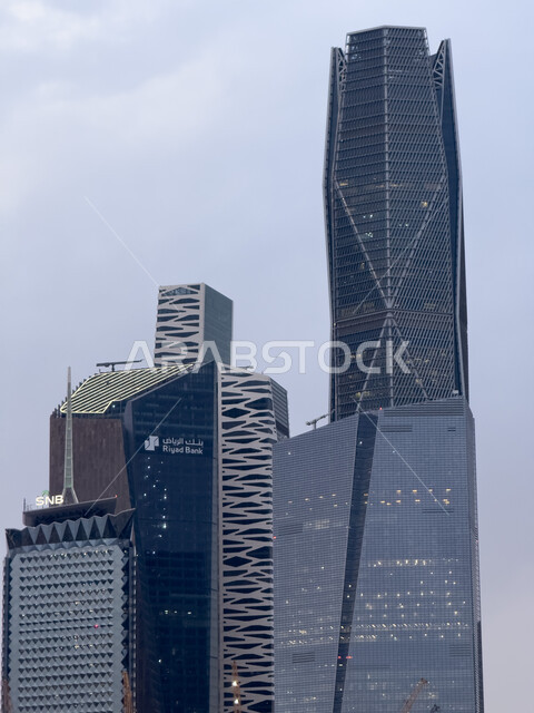 Urban growth and development in Saudi Arabia, King Abdullah Financial Center (KAFD) by day, financial facilities and towers in the city of Riyadh, architectural engineering of the famous buildings and skyscrapers in the Kingdom, achieving economic and commercial renaissance.
