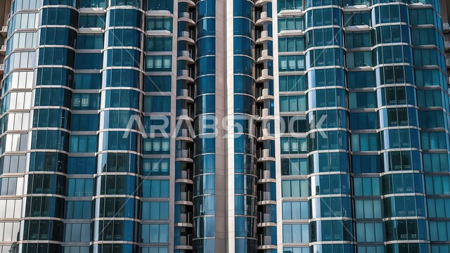 Architectural engineering in a modern and advanced style for constructing buildings and skyscrapers in the city of Dubai, famous places and tourist attractions in daylight, towers and commercial facilities in the city of the United Arab Emirates