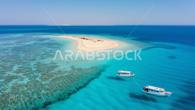 الملاحة البحرية والرحلات الترفيهية، منظر المياه الزرقاء النقية، قاربين يبحران وسط البحر الأحمر قرب جزيرة صغيرة، معالم طبيعية سياحية في المملكة العربية السعودية، المسطحات والثروات المائية في البلاد