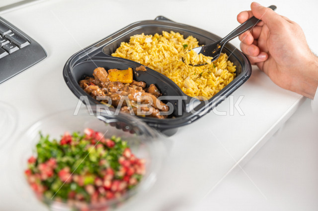 A complete healthy meal consisting of fresh vegetable salad and a plate of meat with a little healthy rice, a diet for a lean body and an ideal weight, cold appetizers and hot meals.