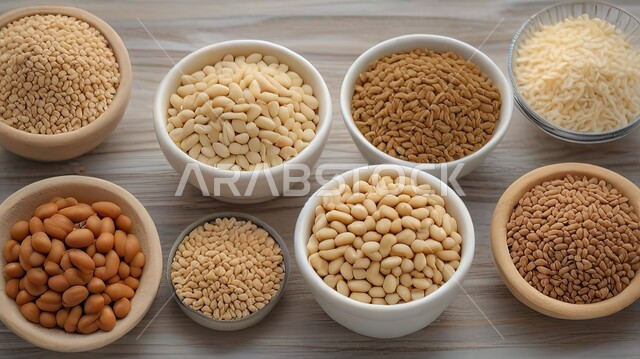 Bowls filled with various types of nutritious and beneficial beans, healthy beans with high nutritional value, a close-up picture from the top of a group of legume dishes, local Saudi national products and crops.
