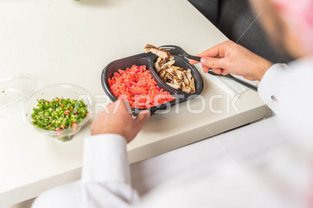 A healthy meal consisting of grilled chicken and a little boiled rice for a healthy and beneficial meal, hot dishes, healthy meals for a slim body, ideal weight.