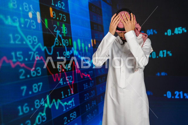 A Saudi-Gulf broadcaster and journalist who has the skill to present economic news releases, face and hands gestures indicating loss and stock market descent, use of graphics technology to provide news and special statistics, global economic news, economi