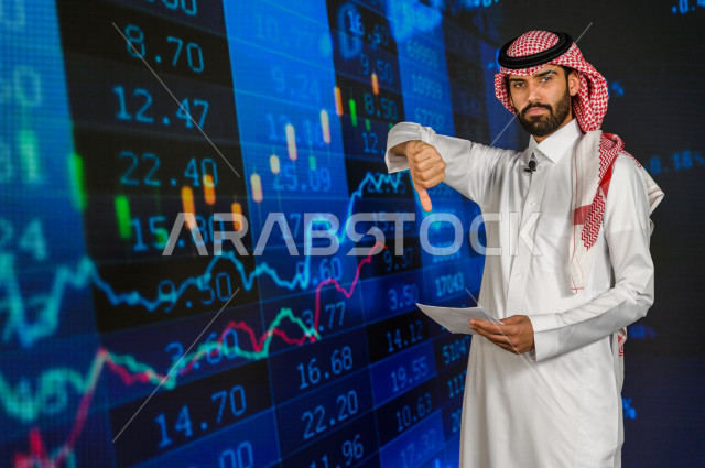 مذيع و اعلامي سعودي خليجي يمتلك المهارة بتقديم النشرات الاخبارية الاقتصادية ، ايماءات وجه و يدين تدل على الخسارة و نزول اسهم البورصة ، استخدام تقنية الجرافيكس في تقديم الاخبار و الاحصائيات الخاصة ، أخبار عالمية اقتصادية ،نشرة الإحصاءات الاقتصادية للدول ال