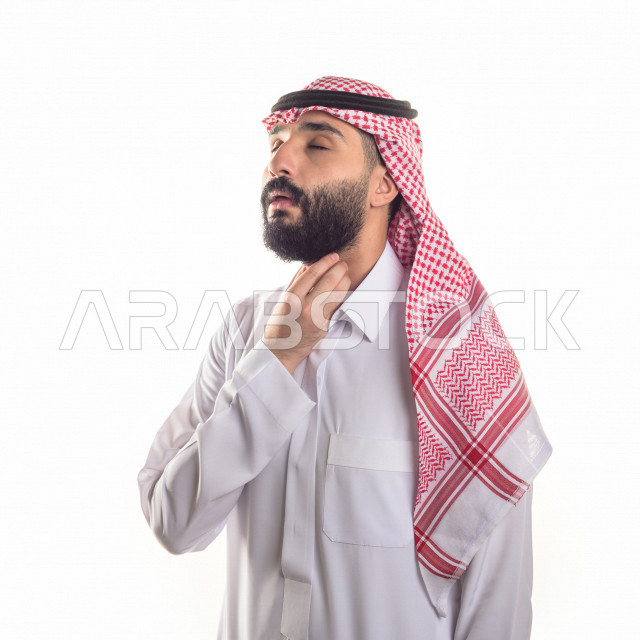 Portrait of a sick Gulf Arab man with face and hand gestures indicating pain and suffering, white background