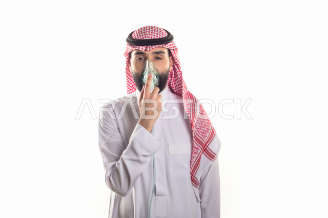 Portrait of a sick Gulf Arab man with face and hand gestures indicating pain and suffering, white background