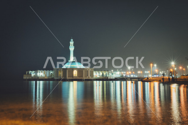 Creative picture of Al-Rahma Mosque and its reflection on the sea, the reflection of the lights on the sea, Al-Rahma Mosque in Jeddah.