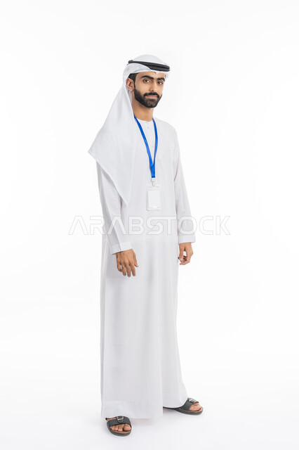 A blank rectangular white mockup, personal photos for official documents, elegance, masculinity and handsomeness, portrait of an Emirati Gulf Arab man wearing a kandora and ghutra wearing a personal badge, standing and looking at the camera, full length body photo, white background