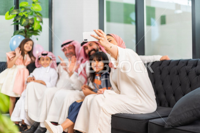 Sharing the wonderful atmosphere of a Saudi family that uses modern technical equipment, voice call, video call, Eid al-Fitr Mubarak, family visits and family gatherings