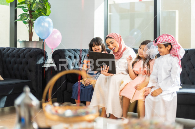 Sharing the wonderful atmosphere of a Saudi family that uses modern technical equipment, voice call, video call, Eid al-Fitr Mubarak, family visits and family gatherings
