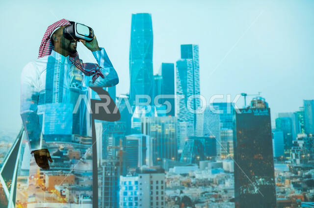 النمو والتطور العمراني في المملكة العربية السعودية, الأبراج وناطحات السحاب السكنية والتجارية في وقت الليل، رؤية مستقبلية 2030، رجل عربي خليجي سعودي يرتدي الثوب التقليدي يقف أمام المعالم السياحية المشهورة وينظر من خلال نظارات الفي ار, المباني والمنشآت الاقتصادية المالية