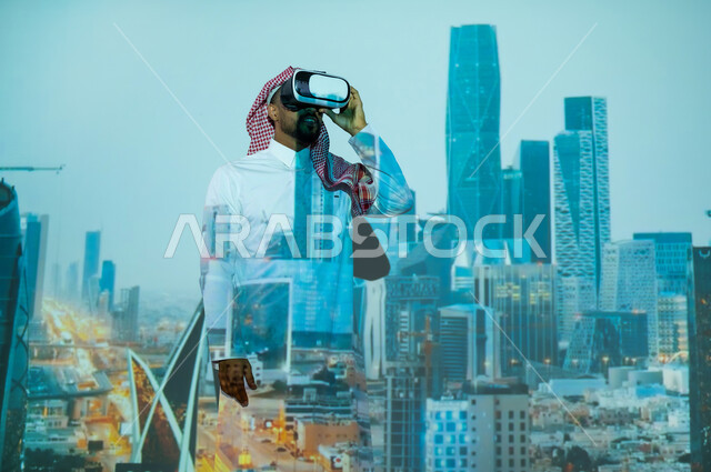 رؤية مستقبلية2030، النمو والتطور العمراني في المملكة العربية السعودية, الأبراج وناطحات السحاب السكنية والتجارية في وقت الليل، رجل عربي خليجي سعودي يرتدي الثوب التقليدي يقف أمام المعالم السياحية المشهورة وينظر من خلال نظارات الفي ار, المباني والمنشآت الاقتصادية المالية