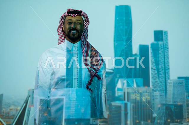 المباني والمنشآت الاقتصادية المالية، الأبراج وناطحات السحاب السكنية والتجارية في وقت الليل، النمو والتطور العمراني في المملكة العربية السعودية, رجل عربي خليجي سعودي يرتدي الثوب التقليدي يقف أمام المعالم السياحية المشهورة, مركز الملك عبد الله المالي كافد