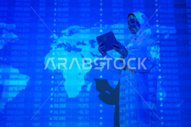 Codes and software symbols that indicate protected data, a veiled Saudi Gulf Arab woman displays a blank black screen on her tablet, scientific and technical development in the Kingdom, numbers and calculations in mathematics, integrating science with technology, background laws and mathematical algorithms