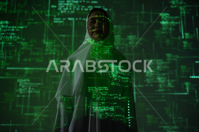Symbols, numbers, and programming languages, the use of advanced modern technologies, a smiling, veiled Saudi Gulf Arab woman standing straight looking at something, technical and technological progress, a background of mathematical laws and algorithms in green