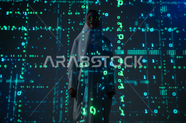 Symbols, numbers, and programming languages, the use of advanced modern technologies, a smiling, veiled Saudi Arabian Gulf woman standing upright, looking at the camera with self-confidence gestures, technical and technological progress, background laws, mathematical algorithms
