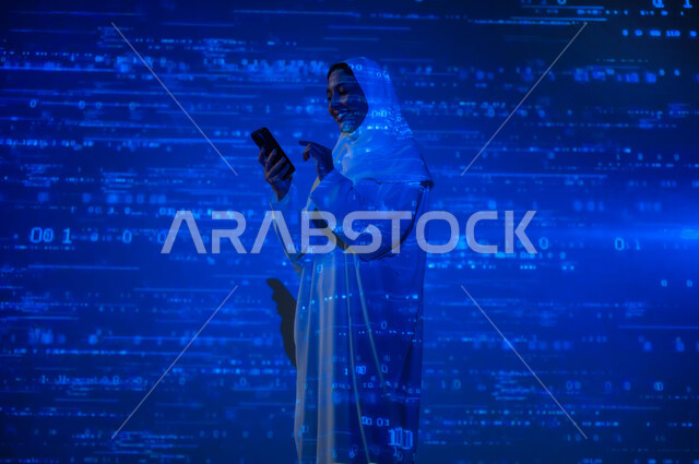حسابات وأرقام في مادة الرياضيات، دمج العلم بالتكنولوجيا، استخدام التقنيات الحديثة المتطورة، إمرأة عربية خليجية سعودية محجبة ترتدي العباءة تمسك الهاتف المحمول, التطور العلمي و التقني في المملكة، خلفية قوانين خوارزميات رياضية
