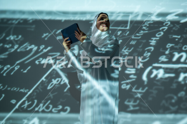 Integrating science with technology, using advanced modern technologies, a veiled Saudi Arabian Gulf woman using a tablet device, scientific and technical development, numbers and calculations in mathematics, a black background for colorful mathematical laws and equations