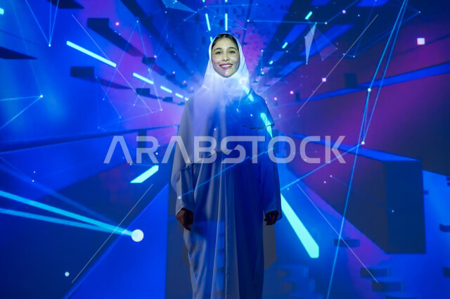 Promoting the concept of digital and technological development in Saudi society, a smiling Saudi Arabian Gulf woman, veiled, wearing an abaya, looking at the camera with gestures of happiness and pleasure, a background of various colors using holographic technology