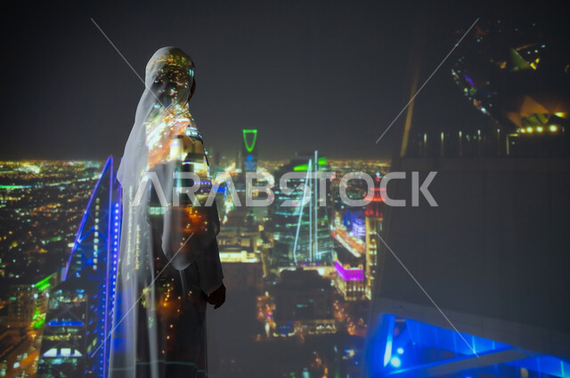 النمو والتطور العمراني في مدينة الرياض، الأبراج وناطحات السحاب في المملكة، صورة من الخلف لإمرأة عربية خليجية سعودية محجبة ترتدي العباءة تنظر الى المباني والشوارع، أماكن ومعالم سياحية مشهورة، الفنون والتصاميم المعمارية المتطورة