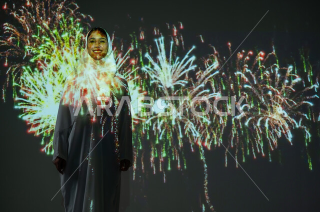 Celebrating Saudi National Day, celebrations and festivals in the Kingdom, enjoying fireworks on holidays and occasions, entertainment activities and festive events, a smiling Saudi Gulf Arab woman wearing an abaya and hijab looking at firecrackers
