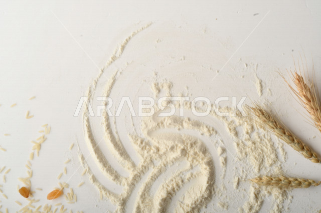 مجموعة من الأرز والزبيب والطحين على خلفية بيضاء