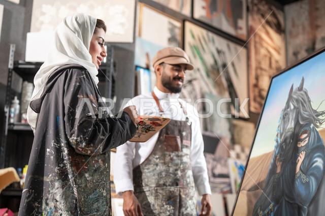 دمج الألوان المناسبة لإتمام الرسوم , معرض الرسومات و اللوحات التشكيلية في السعودية , رسامان عربيان خليجيان سعوديان يقومان بالتعاون لإنجاز مشروع فني ناجح , مفهوم الموهبة و الإبداع , ورشة عمل فنية