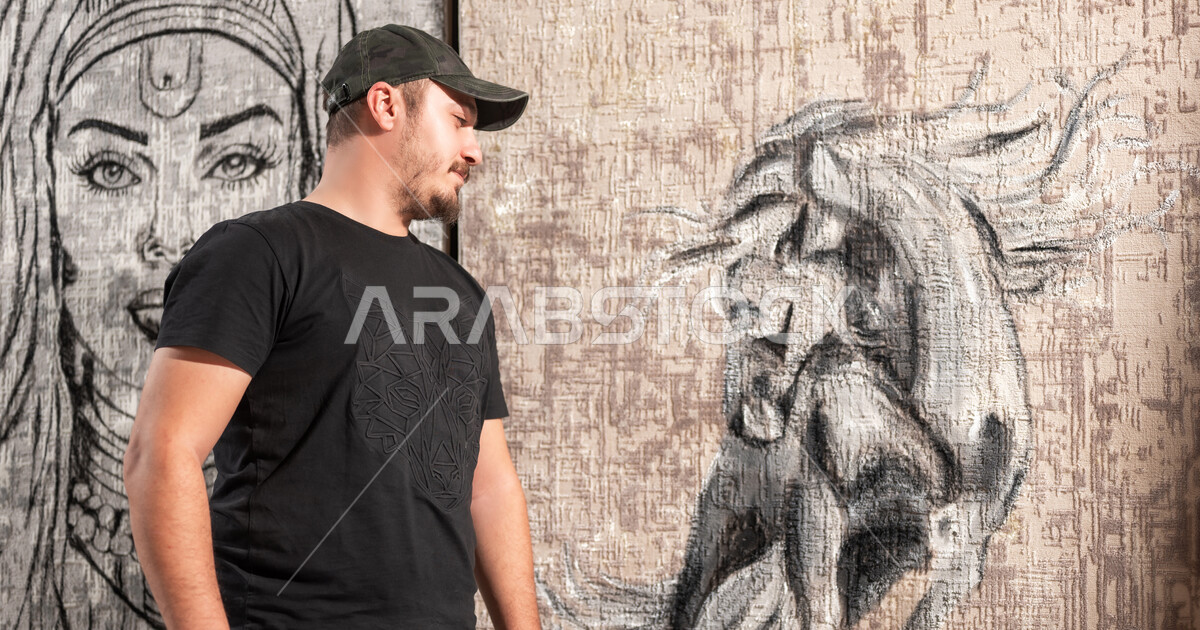 عرض الرسومات و اللوحات الفنية , رسام عربي خليجي سعودي يرتدي الزي ...